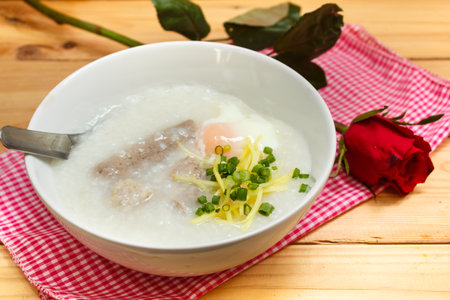 porridge with egg and liver, traditional chinese.の写真素材