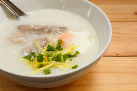 porridge with egg and liver, traditional chinese.の写真素材
