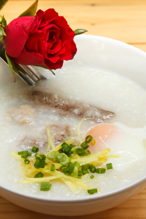 porridge with egg and liver, traditional chinese.の写真素材
