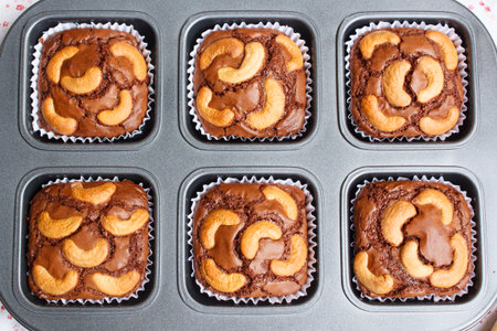 chocolate brownie and cashew cupcake, fresh homemade.の写真素材
