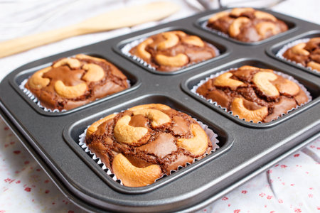 chocolate brownie and cashew cupcake, fresh homemade.の写真素材