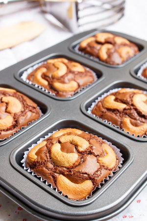 chocolate brownie and cashew cupcake, fresh homemade.の写真素材