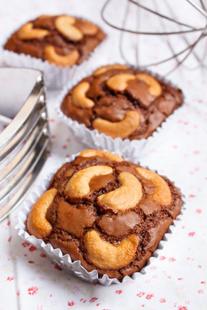chocolate brownie and cashew cupcake, fresh homemade.の写真素材