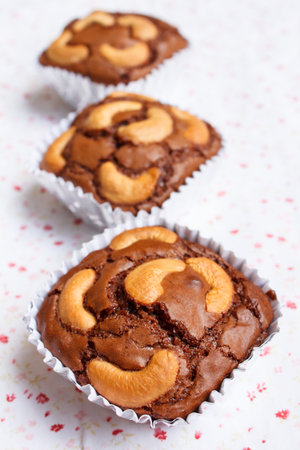chocolate brownie and cashew cupcake, fresh homemade.の写真素材