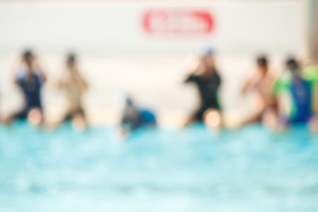 blur of children in the pool, background.の写真素材