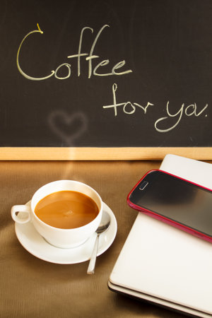 cup of hot coffee in coffee shop.