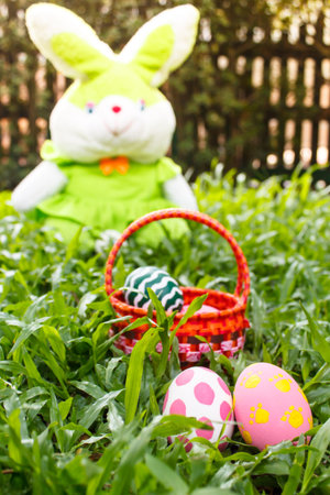 easter eggs and green rabbit in the garden.の写真素材