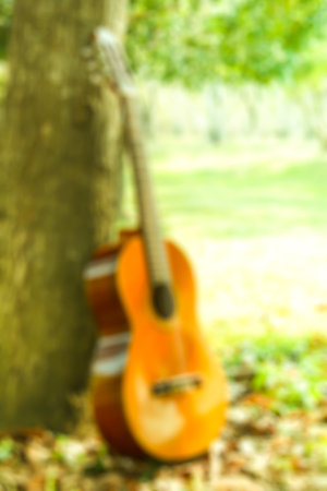 blur natural and guitar background in the park.の写真素材
