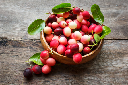 karanda fruit, carissa carandas on the old wood background.の写真素材