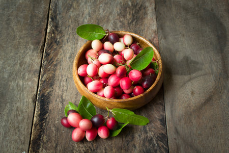 karanda fruit, carissa carandas on the old wood background.の写真素材