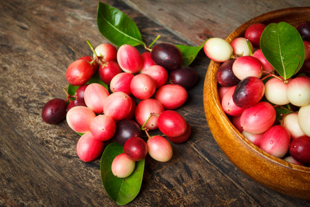 karanda fruit, carissa carandas on the old wood background.の写真素材