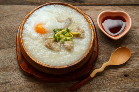 porridge with egg and liver, traditional chinese food.の写真素材