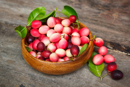 karanda fruit, carissa carandas on the old wood background.の写真素材