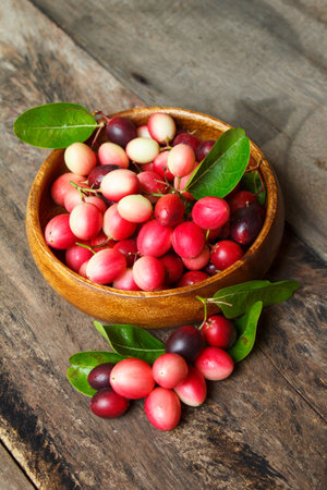 karanda fruit, carissa carandas on the old wood background.の写真素材