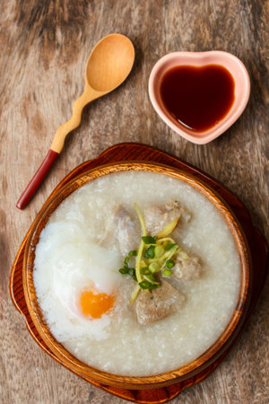 porridge with egg and liver, traditional chinese food.の写真素材