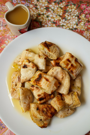 Grilled banana serve with syrup, Thai snack.の写真素材