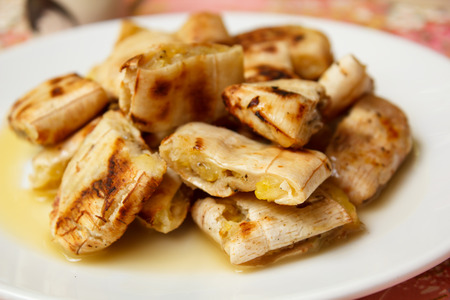 Grilled banana serve with syrup, Thai snack.の写真素材