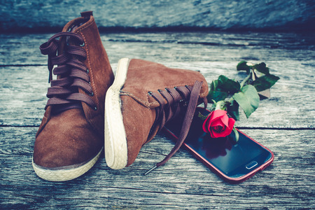 Brown shoe on old wood background, still life.の写真素材
