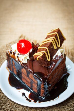 Sliced delicious chocolate cake in white plate.の写真素材