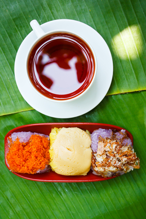 Thai Traditional Dessert, Sticky rice custard wrapped in banana leaves.の写真素材