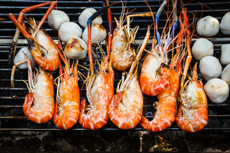 Grilled prawns on the barbecue rack at the party.の写真素材
