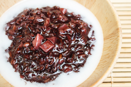 Thai dessert, Black sticky rice pudding with taro.の写真素材