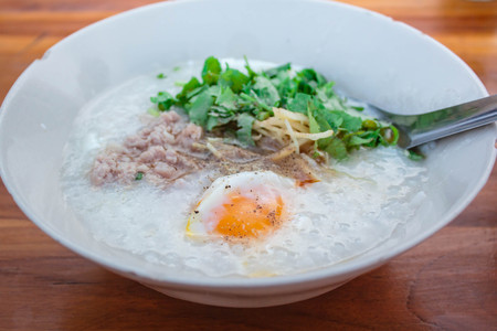 porridge with pork and egg, traditional chinese.の写真素材
