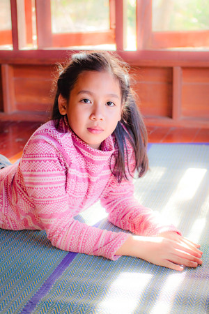 Portrait of pretty teenager girl when the sunlight shines.