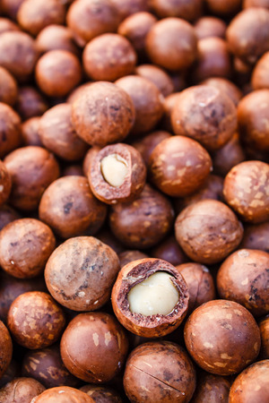 Shelled and unshelled macadamia nuts.の写真素材