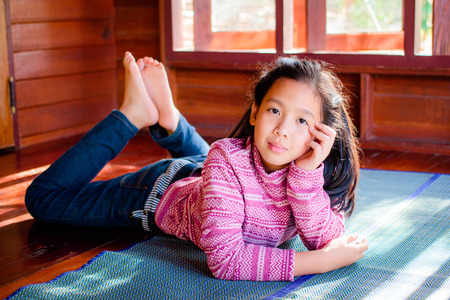 Portrait of pretty teenager girl when the sunlight shines.の写真素材