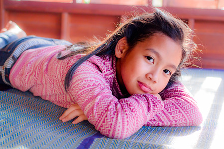 Portrait of pretty teenager girl when the sunlight shines.の写真素材