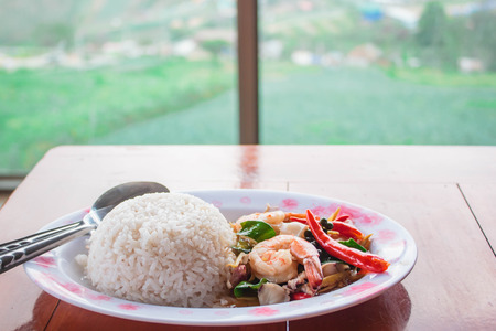 Fried spicy seafood and rice, thai style food.の写真素材