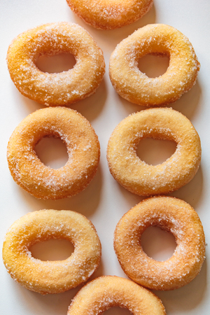 Donuts with sugar on white background, thai food style.の写真素材