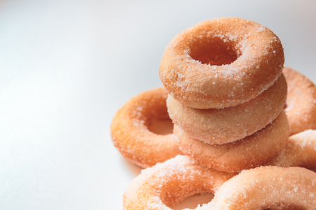 Donuts with sugar on white background, thai food style.の写真素材