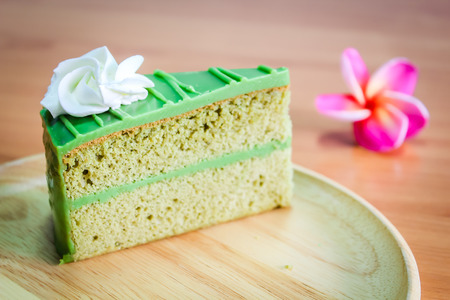 Pandan Cake dessert on wood background.の写真素材