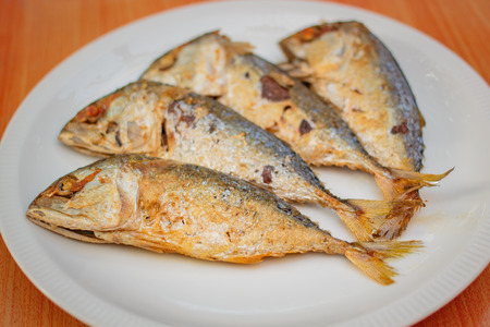 fried mackerel in white plate, thai food.の写真素材