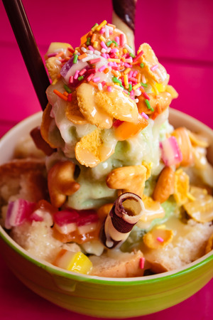Shaved ice, thai style dessert made of shaved ice, bread, sweetened condensed milk.の写真素材
