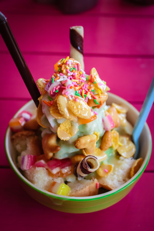Shaved ice, thai style dessert made of shaved ice, bread, sweetened condensed milk.の写真素材