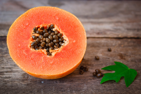 Ripe papaya on old wooden background, fruit asia.の写真素材