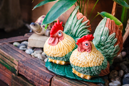 Dolls for garden decoration, couple chicken.の写真素材