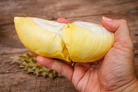 Durian on a wooden background, fresh fruit.の写真素材