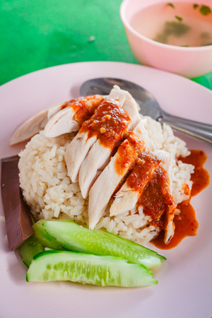 Hainanese chicken rice, steamed chicken with rice and sauce.の写真素材
