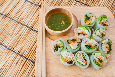 Fresh vegetable noodle spring roll with spicy sauce, thai style.
