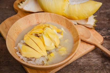 Sticky rice with durian and coconut milk sauce, thai dessert.の写真素材