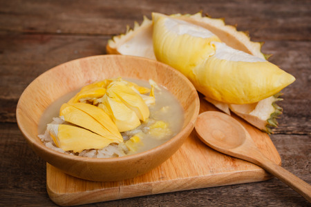 Sticky rice with durian and coconut milk sauce, thai dessert.の写真素材