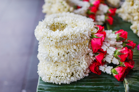 Fresh flower steering wheel, Jasmine rose garland, steering wheel of jasmine flower at street market in thailand.の写真素材
