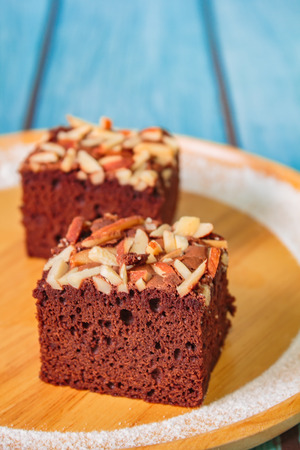 Homemade brownie cake decorated with almond and chocolate.の写真素材