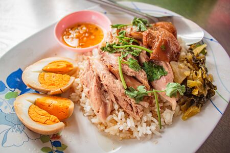 Stewed pork leg on rice serve with egg boil, street food thai style .の写真素材