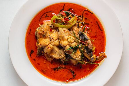 Catfish with spicy red curry paste, thai food.の写真素材