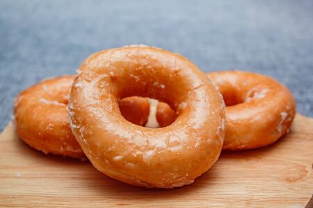 Donut with sugar on a white color plate, Donut toppint with sugar.